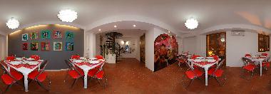 Large dining room with tables and chairs for up to 20 people