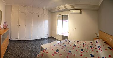 dormitorio doble con acceso a terraza