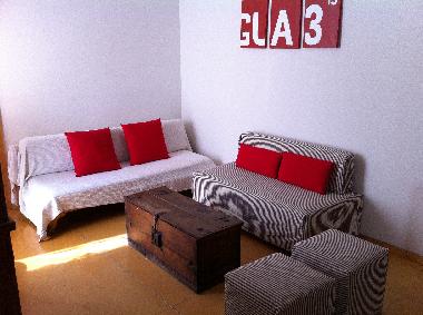 La sala con TV y sofa cama.